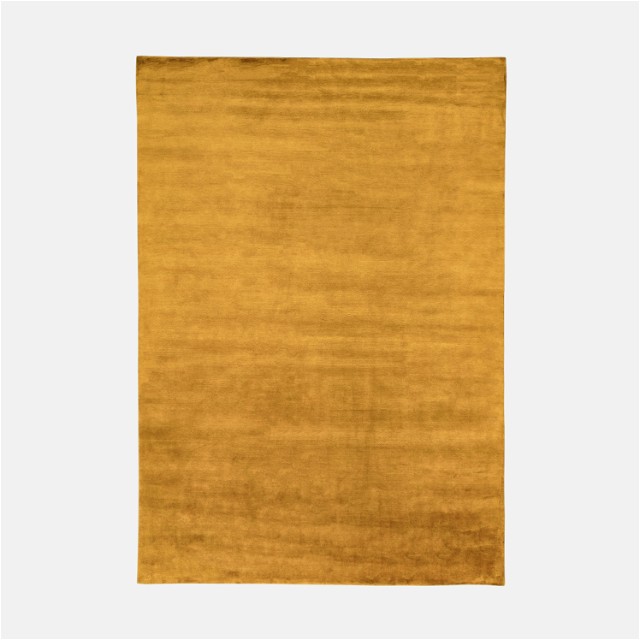 a yellow rug with a white background