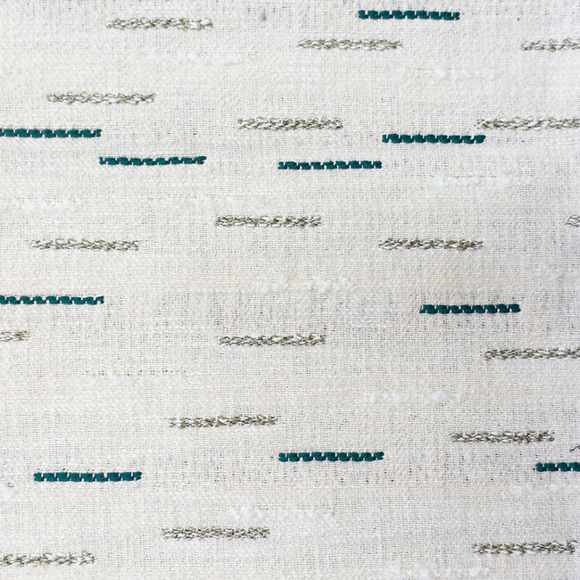 a close up of a white and blue rug