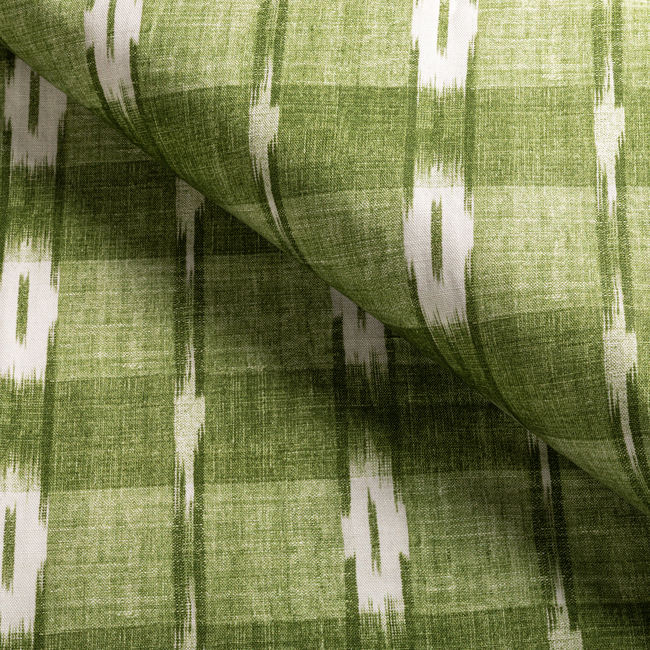 a close up of a green and white fabric