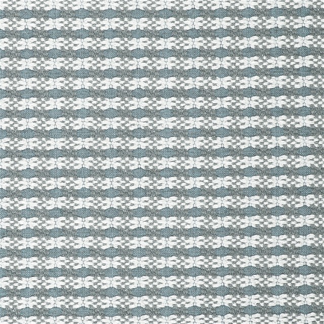 a close up of a gray and white rug